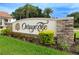A beautifully landscaped entrance sign reading 