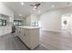 Open-concept kitchen with a large island, modern appliances, and sleek flooring for seamless entertaining at 6019 Crystal View Dr, Orlando, FL 32819