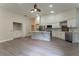 Open concept kitchen featuring stainless steel appliances, ample storage space, and a marble waterfall island at 6019 Crystal View Dr, Orlando, FL 32819