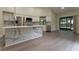 Modern kitchen with stainless steel appliances, white cabinetry, and a marble island at 6019 Crystal View Dr, Orlando, FL 32819