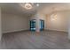 The bright and airy living room features sleek flooring and sliding glass doors leading to the outdoors at 6019 Crystal View Dr, Orlando, FL 32819