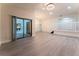 Spacious living room with modern lighting, sleek floors, access to the backyard, and a staircase at 6019 Crystal View Dr, Orlando, FL 32819