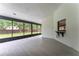 View of the screened patio featuring porcelain tile flooring and access to the backyard at 6019 Crystal View Dr, Orlando, FL 32819