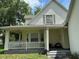 Inviting front porch with white picket railing and ample space for seating and relaxing at 6230 Cranberry Dr, Port Orange, FL 32127