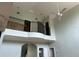 Soaring ceilings with interesting architectural details and a balcony overlooking the living area at 6230 Cranberry Dr, Port Orange, FL 32127