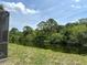 Lush greenery views from the backyard, overlooking a canal and more tropical plants at 6230 Cranberry Dr, Port Orange, FL 32127
