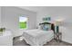 Bright bedroom with a cozy bed, stylish decor, and a large window offering a pleasant view at 648 Terrapin Dr, Debary, FL 32713