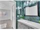 Full bathroom featuring marble tiling, vanity, and neutral tile flooring at 664 Kenwick Cir # 104, Casselberry, FL 32707