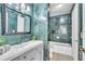 Full bathroom featuring marble tiling, vanity, and bathtub at 664 Kenwick Cir # 104, Casselberry, FL 32707
