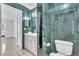 Full bathroom featuring marble tiling, vanity, and neutral tile flooring at 664 Kenwick Cir # 104, Casselberry, FL 32707