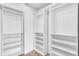 Walk in closet featuring built in shelving and hanging storage at 664 Kenwick Cir # 104, Casselberry, FL 32707
