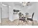 Cozy dining area features elegant furniture and a modern ceiling fan, perfect for Gathering meals at 664 Kenwick Cir # 104, Casselberry, FL 32707