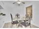 Inviting dining area showcasing stylish furnishings, a ceiling fan, and great natural light at 664 Kenwick Cir # 104, Casselberry, FL 32707