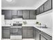 Functional kitchen features sleek appliances and ample counter space for culinary adventures at 664 Kenwick Cir # 104, Casselberry, FL 32707