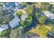 An aerial view shows a home on a canal with backyard fire pit at 6805 Barby Ln, Belle Isle, FL 32812
