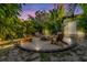 Inviting backyard fire pit surrounded by lush landscaping and seating at 6805 Barby Ln, Belle Isle, FL 32812