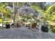 Outdoor deck with an umbrella with chairs at 6805 Barby Ln, Belle Isle, FL 32812