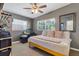 Well-lit bedroom with grey walls, a comfortable bed, and a large window at 6805 Barby Ln, Belle Isle, FL 32812