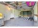 The garage with ceiling-mounted surfboards, is a standout feature perfect for surf enthusiasts at 6805 Barby Ln, Belle Isle, FL 32812