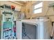 This laundry room boasts modern washer and dryer units, combining efficiency with contemporary design at 6805 Barby Ln, Belle Isle, FL 32812