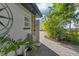 An outdoor shower with a brick-paved walkway, enhances the property's appeal with its practicality and aesthetic touch at 6805 Barby Ln, Belle Isle, FL 32812