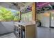 Outdoor wet bar with concrete block and stucco base construction, ceiling fans, and nice views at 6805 Barby Ln, Belle Isle, FL 32812