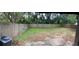 Large backyard featuring a wood fence, a concrete patio and a grassy area at 7266 Oak Meadows Cir, Orlando, FL 32835