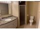 Bathroom with a granite countertop vanity and glass door shower at 7266 Oak Meadows Cir, Orlando, FL 32835