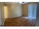 Spacious bedroom featuring wood-look floors, ceiling fan, and ample natural light at 7266 Oak Meadows Cir, Orlando, FL 32835