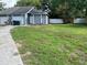 Charming single-story home with well-maintained lawn, garage, and inviting entrance at 7266 Oak Meadows Cir, Orlando, FL 32835