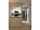 Charming kitchen featuring stainless steel appliances, granite countertops, and white cabinets at 7266 Oak Meadows Cir, Orlando, FL 32835