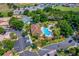 Aerial view of the community featuring a clubhouse, pool, and parking area at 7742 Sugar Bend Dr # 7742, Orlando, FL 32819