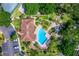 Bird's-eye view of the clubhouse and pool, complemented by lush landscaping at 7742 Sugar Bend Dr # 7742, Orlando, FL 32819