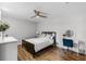 Comfortable bedroom offers wood floors, a ceiling fan, and space for a small desk at 7742 Sugar Bend Dr # 7742, Orlando, FL 32819