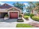 Charming single story villa with an attached garage and mature landscaping at 7742 Sugar Bend Dr # 7742, Orlando, FL 32819