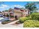 Charming two-story home with a tile roof, manicured landscaping, and an attached garage at 7742 Sugar Bend Dr # 7742, Orlando, FL 32819
