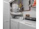 Functional laundry area with washer, dryer, and water heater at 7742 Sugar Bend Dr # 7742, Orlando, FL 32819