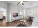 Bright living room features wood floors, high ceilings, and a modern ceiling fan with an open floor plan at 7742 Sugar Bend Dr # 7742, Orlando, FL 32819