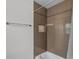 Bathroom shower features brown tile and built in alcove at 7742 Sugar Bend Dr # 7742, Orlando, FL 32819