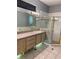 Bathroom features a vanity, walk in shower and separate tub at 7924 Bridgestone Dr, Orlando, FL 32835