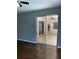 Bedroom with wood flooring and sliding glass doors to the outdoor patio at 7924 Bridgestone Dr, Orlando, FL 32835