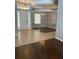 Foyer featuring neutral paint, hardwood and tiled flooring, and a chandelier at 7924 Bridgestone Dr, Orlando, FL 32835