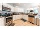 Spacious kitchen featuring stainless steel appliances and tile flooring at 7924 Bridgestone Dr, Orlando, FL 32835