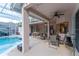 Outdoor patio features ceiling fans, dining area, and a view of the pool at 7924 Bridgestone Dr, Orlando, FL 32835