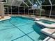 Relax in the pool and spa protected by a screened enclosure with plenty of sunshine at 7924 Bridgestone Dr, Orlando, FL 32835