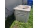 Outdoor AC unit surrounded by green grass and plants at 826 Horseshoe Bay Dr, Kissimmee, FL 34741