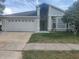 Charming single-Gathering home featuring an attached garage and a well-maintained front yard at 826 Horseshoe Bay Dr, Kissimmee, FL 34741