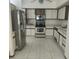 Kitchen with stainless steel refrigerator and white cabinets at 826 Horseshoe Bay Dr, Kissimmee, FL 34741