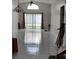 Bright living room with tiled floors and sliding glass doors to the backyard at 826 Horseshoe Bay Dr, Kissimmee, FL 34741