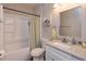 Cozy bathroom features a vanity with granite countertop and updated fixtures at 835 Grand Regency Pt # 104, Altamonte Springs, FL 32714